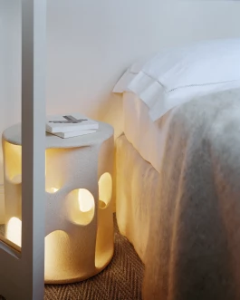 bed with Alexandre Turpault bed linen and Brun de Vian Tiran mohair blanket and white plastered illuminated bedside table by Guy bareff 